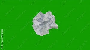 Blank white paper Crushed and wrinkled, it turns into a ball using stop-motion techniques. green background