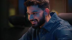 Night computer work smiling Indian Arabian businessman satisfied ethnic guy male business man ceo programmer manager entrepreneur online typing laptop computer commerce project in dark evening office