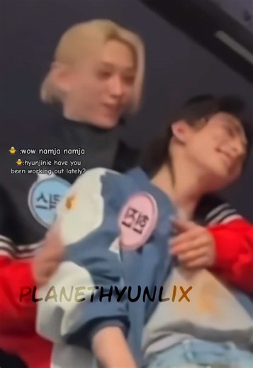 hyunjin leaned on felix, felix squeeze hyunjin's arm and shoulder muscles, he touched them while saying,