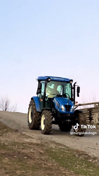 New Holland TD 75 D Tractor in Action