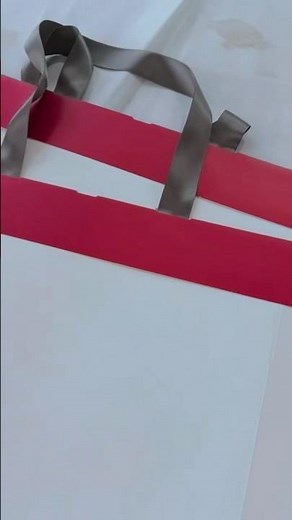 Automatic paper bag ribbon threading and attaching machine. #paperbagmachine #ribbonpastingmachine