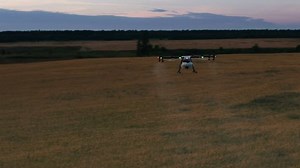 clip-32211673-agriculture-drone-flying-spraying-on-field-shot
