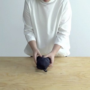 Here's how you fold your MUJI Down jacket (Men’s) into a small attached pouch. This fold makes it very convenient to carry around and saves a lot of space while packing for trips. #down #jacket #compact #fold #winterwear #GoodQuality #EasyPrices #NowAndAlways #MUJILife #GoodsOfReason #Basics #MUJIisEnough #MUJIIndia #MUJI #無印良品 | MUJI India