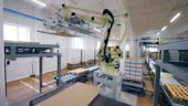 Carton packaging unit with a massive robotic machine. 4K