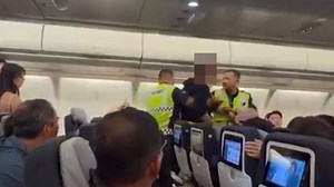 Stewardess ‘groped on flight’ as clip shows ‘perv passenger’ being dragged off
