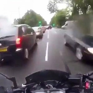 A filtering motor bike cleans up a lady not looking where she's going... who's at fault? | Dash Cam UK