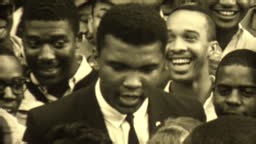 Professional boxer Muhammad Ali speaking to reporter about Civil...