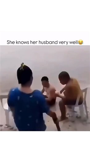 panthoprimex on Instagram: "This video captures a playful and humorous interaction among three people, two men and one woman, in a water-filled environment, possibly a flooded beach or shallow body of water. The video begins with the three individuals seated on white plastic chairs which are partially submerged in the water, facing away from the camera. The setting is bright but hazy or overcast. The two men are shirtless and wearing shorts, while the woman is wearing a dark blue patterned dress