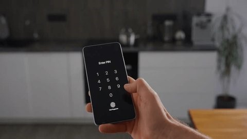 clip-3999677707-verification-process-on-phone-bright-kitchen-closeup