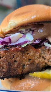 Your new Burger of the Month is this glorious MEATLOAF SANDWICH. This big, beautiful sandwich is made with @woodfarmsfw beef meatloaf grilled with a brown sugar glaze, topped with slaw, bread and butter pickles, and house made apple butter with local apples from @ambrosiaorchardfw, and then it's all sandwiched between Martin's @potatorolls! Stop by and treat yourself with this beast anytime in November🤤 | Bravas