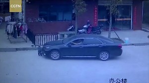3M views · 6.7K shares | A two-year-old boy survived being hit by a car in east China’s Fujian Province. Surveillance video shows a car running over the child. The driver was talking on his phone and did not see the toddler. | CGTN | Facebook