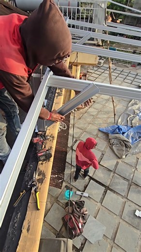 installation of support brackets on canopy poles #builder #diy #counstruction #roof #gutters