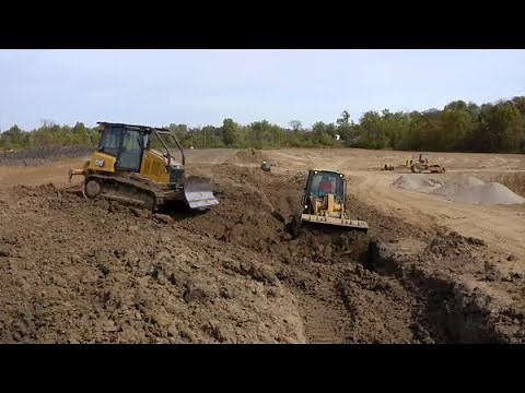 Working Together: Cat® D4 Dozer and 953 Track Loader