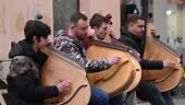 A group performs music on traditional Ukrainian bandura stringed...