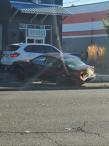Happened 2 Hours ago: Car Crashes into Drive thru at StarBucks next to King Street McDonald's in Bellingham, WA. Photo Credit: Logan Blair | Bellingham Metro News