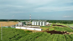 Grain storage. Silo at farm. Elevator for corn storage and grain. Feed Silos Hopper for wheat storage and barley. Storing grain and compound feeds. Agricultural warehouse. Wheat import in food crisis.