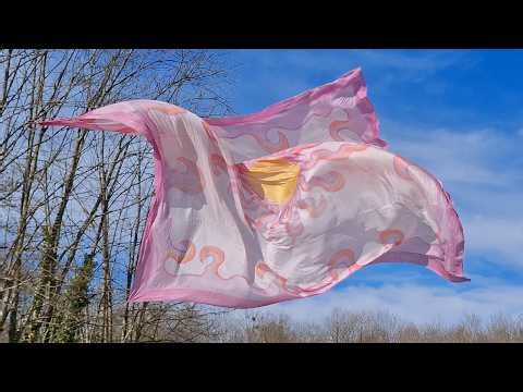 Silk fluttering noisily in the wild wind