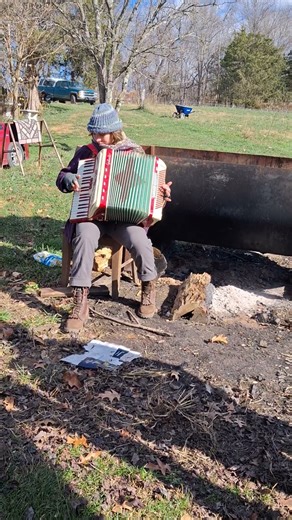 accordian player at hippie commune