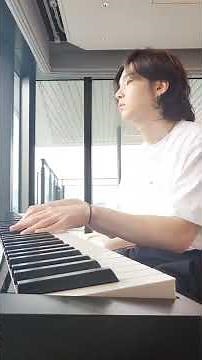 Suga playing piano