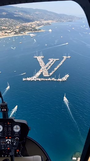 Outfit Society on Instagram: "Louis Vuitton displayed a unique formation of yachts arranged to create the iconic "LV" logo This display was created using AI to create the flotilla in the shape of the logo. @afinsky"