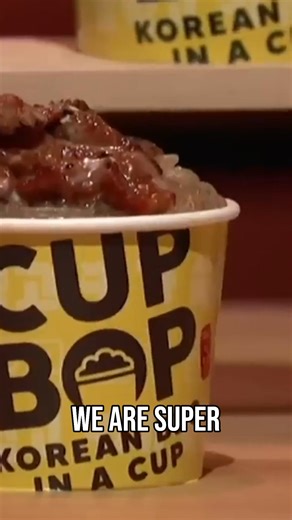 Doc and Jung showcase Cupbop in front of the Sharks, offering a taste of their unique Korean BBQ in a cup. This is Korean BBQ, but like you've never seen it before! #Cupbop #KoreanBBQ #SharkTank #FoodInnovation #Entrepreneurship | Shark Tank Global