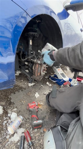 Mobile mechanic working against the elements. @highlight | Austin Gullett