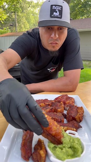 🔥💨🐖🥑 💦 🔊Sound On for some Crunchy Juicy Smokin’ Fried Pork Belly Strip dipped in guacamole action. I’ve been working on this recipe because it’s so delicious and not hard to make. Made a batch on my Premium Kettle and another batch which is this batch on my offset Smoker. Stay tuned in for the full start to finish cook I’m working on. #bbq #pork #porkbelly #recipe #food #foryoupage