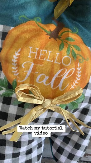 This potholder made the perfect pocket for a fall arrangement. Check out my tutorial video to see how I put it all together. #craftalong #crafty #fallcraftdiys #farmhousestyle #crafting #craftingideas #crafts #falldecorating #falldecorideas #pumpkindiy #pumpkincrafts #easycraft #easyfallcraft #cheapcrafts #dollartreecrafts #dollartree #dollartreediy #octobervibes | A Rustic Stitch