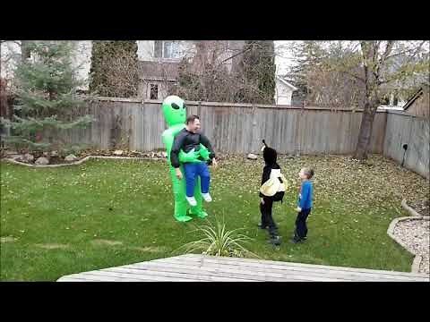 Green Alien Carrying Human Costume
