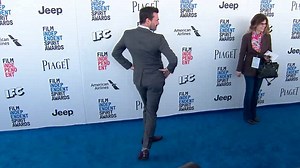 Such a Hamm! Jon Hamm does backless dress pose at Spirit Awards