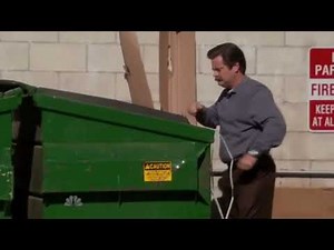 Guy throws computer in the trash