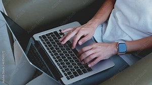 A girl is typing on a laptop keyboard, close up view. High quality FullHD footage