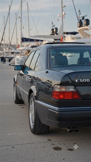 W124 parked on the shore with yachts #automobile