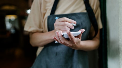 Customers divided after server shares real meaning behind 'check face down'