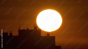 4 in 1 video! The sunrise above city buildings roof - extreme close up telescope view. Shot with Red Cinema Camera Stock Video