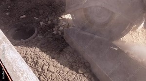 Petrol power saw cutting through concrete path edging kerb