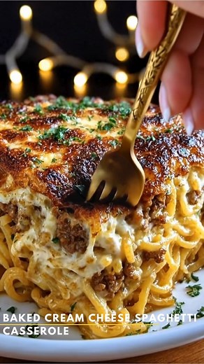 Baked Cream Cheese Spaghetti Casserole *This cozy casserole takes classic spaghetti and transforms it into a creamy, cheesy, baked comfort dish — perfect for an easy family dinner or a warm, hearty meal that feels like home.* What You'll Need 12 oz spaghetti 1 tablespoon butter 1 cup finely diced onion 3 cloves garlic, minced 1 lb ground beef or Italian sausage 1 jar (24 oz) marinara sauce 8 oz cream cheese, softened 1/2 cup sour cream 1 cup shredded mozzarella 1/2 cup grated Parmesan 1 teaspoon