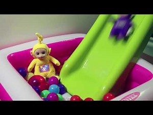 Teletubbies playing in the ball pit with colorful balls and sliding