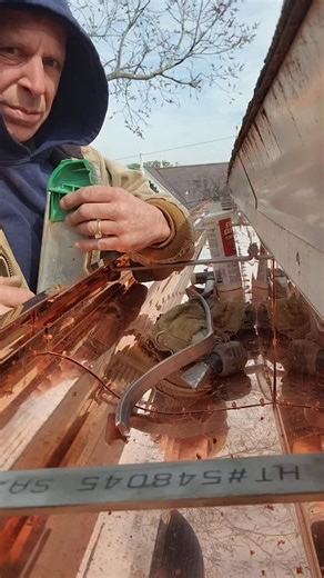 Josh on Instagram: "Soldering custom handmade copper gutters. #soldering #copper #gutters #roofing #construction"
