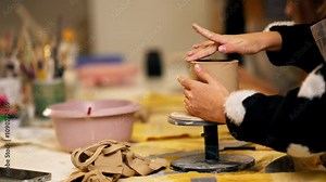 close-up in clay modeling studio applied art clay pottery old craftsmanship manual making of pottery smoothing out irregularities with a stack