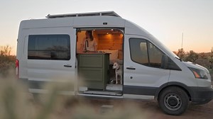This DIY Camper Van Is an Affordable Tiny Home With a Snug Interior and a Pull-Out Garage