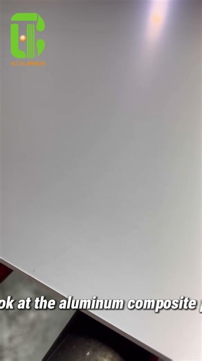 A close-up view of the aluminum composite panel production line