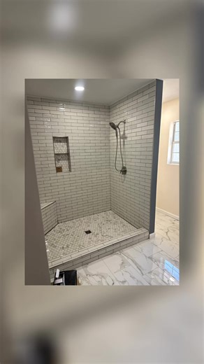 From cramped & dated ➜ calm, clean, and custom. This bathroom went from dark finishes, limited function, and visual clutter… to a bright, open space designed for real life. ✔️ Walk-in tile shower with bench & niche ✔️ Marble-look flooring for a clean, elevated feel ✔️ Custom cabinetry & quartz countertops ✔️ Fresh layout that maximizes space and light Because your bathroom shouldn’t feel like a tight squeeze — it should feel like a reset. Floor Depot Plus handles the design, materials, and insta