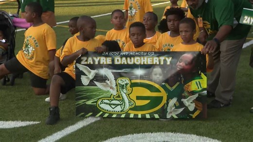 Friends, family, football teammates gather to honor 7-year-old shot at DeKalb gas station