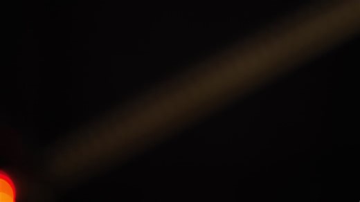 Bokeh shot of defocused blurred christmas tree light that is blinking on black | Premium Stock Video Footage