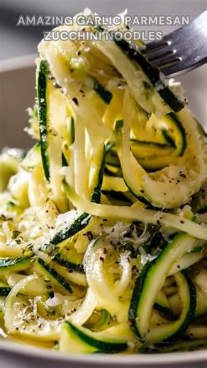 Zucchini spiralized and sautéed with garlic. Sprinkle salt, black pepper, Parmesan. Cook 3 minutes on medium heat. Tender-crisp noodles coated in melted, cheesy goodness. Ingredients ➤ 2 medium zucchini ➤ 2 tablespoons olive oil FULLL Recipe in First Cօʍʍеոτ 👇👇 | Nessy Recipes