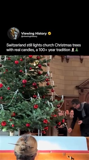 Divine Design Decor on Instagram: "Some traditions are so worth hanging on too 🕯️ wait for it • @viewinghistory In Switzerland, some churches still keep a centuries-old Christmas tradition alive by lighting real candles on their holiday trees. Instead of electric lights, actual flames flicker on the branches, giving the whole space a warm, old-world glow that feels straight out of history. It’s a practice rooted in culture and ceremony, carefully maintained so the ritual stays safe while preser