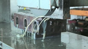 Cylinder head and block resurfacing. Engine block repair process on the grinding machine