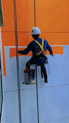 Repainting a building manually for a fresh new look