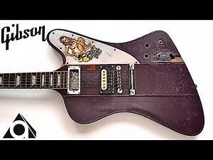 Restored Gibson guitar in terrible condition.